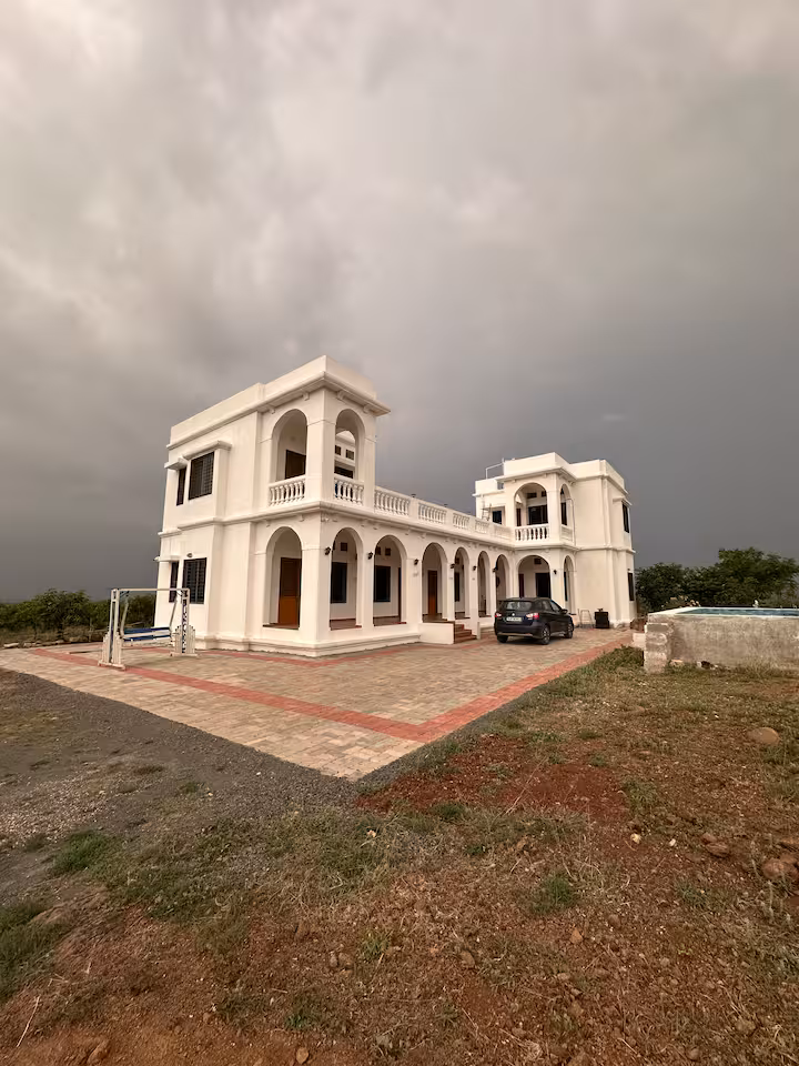 White Revan Hills villa on a cloudy day