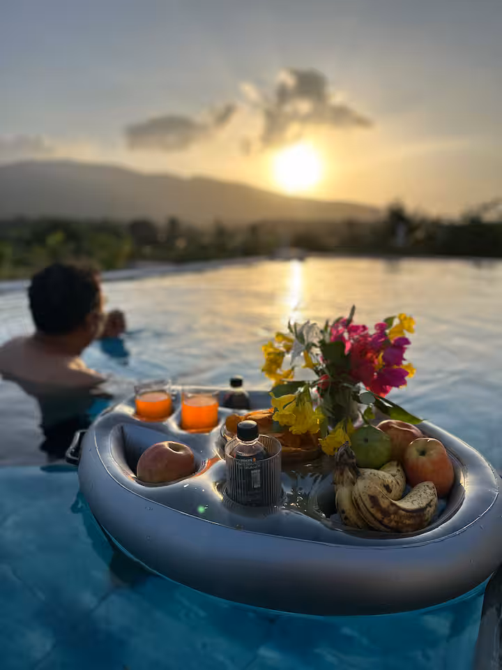 Floating breakfast in the Revan Hills infinity pool at sunset