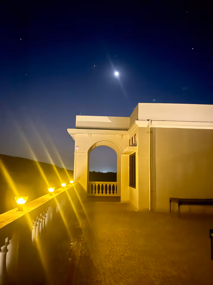 Revan Hills upper terrace and arches lit at night